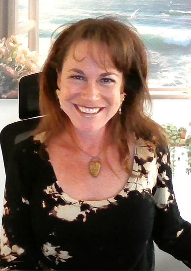 Michele Harris in the office ocean picture background