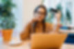 lady holding card looking at computer confused