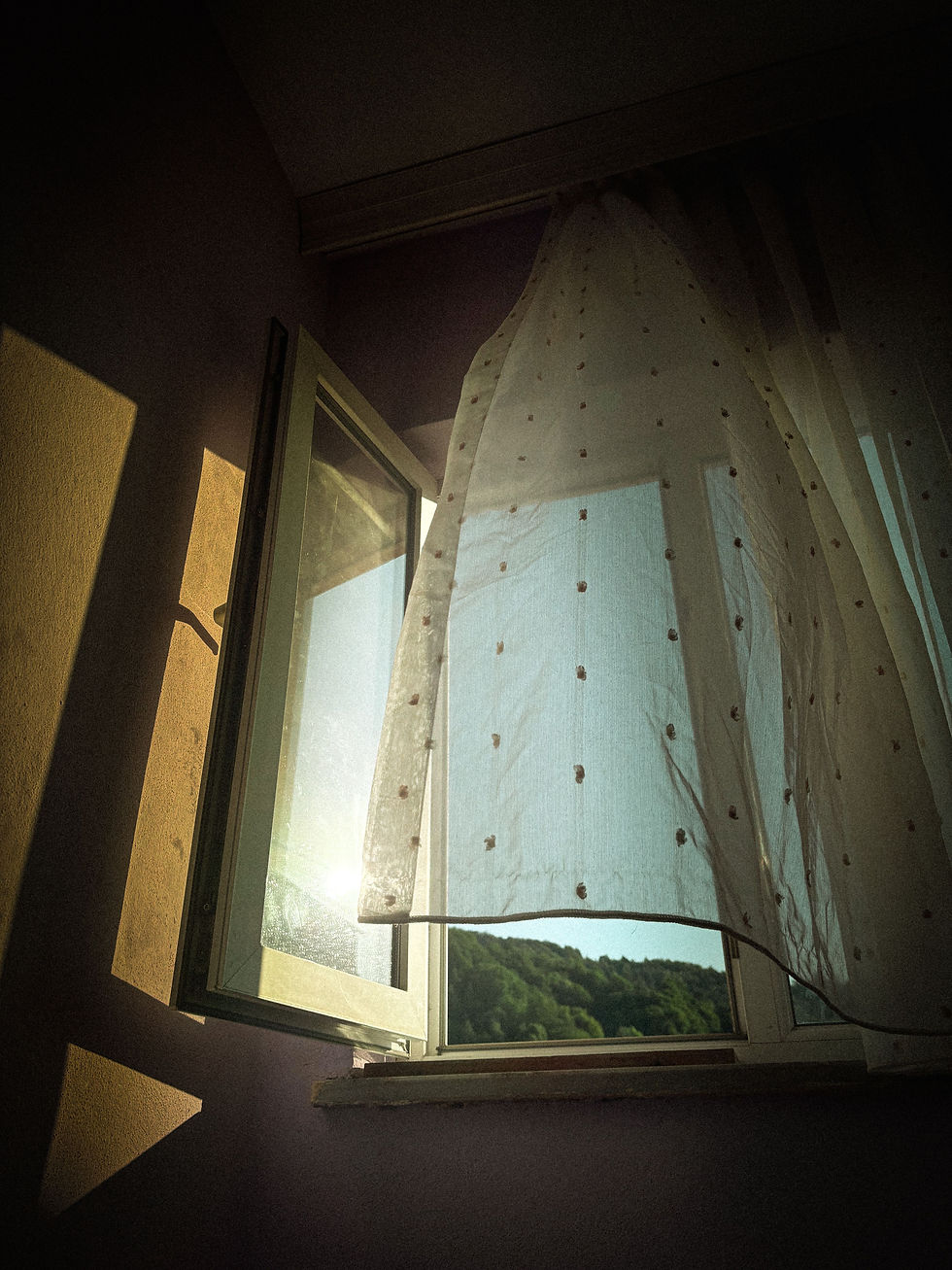 curtain blowing from window draft