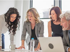 Four business professionals collaborating in a meeting