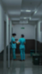 nurses standing together in a hallway