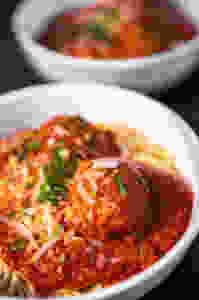 Vegetarian meatballs over spaghetti.