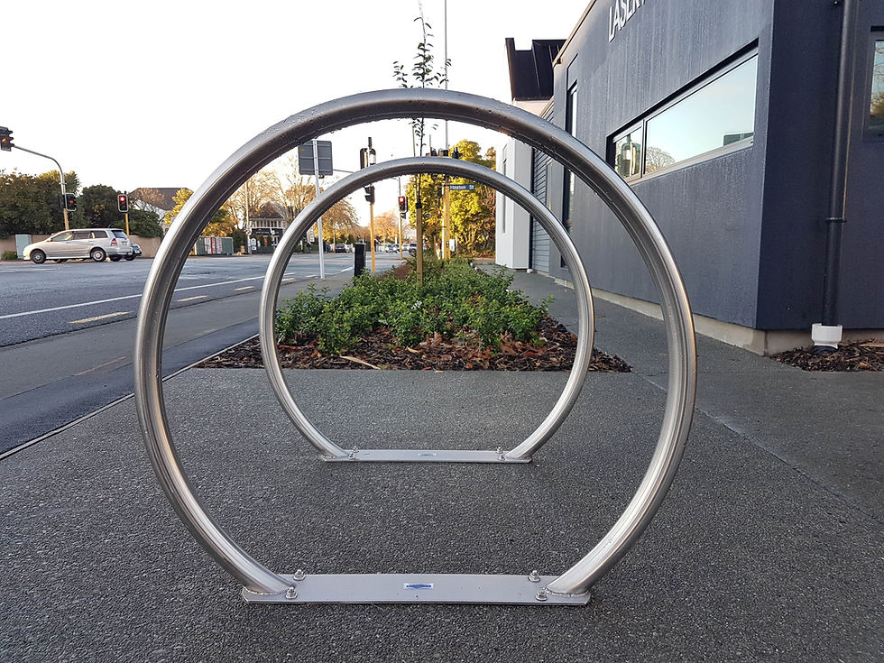 Stainless steel hoop plate bike rack installed on footpath