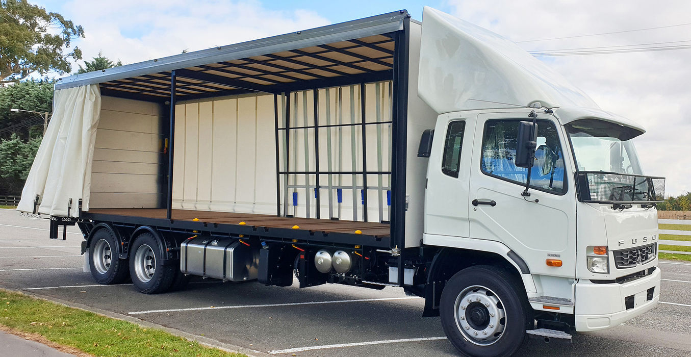 Glass trolley truck with side curtain open showing internal trolley bays