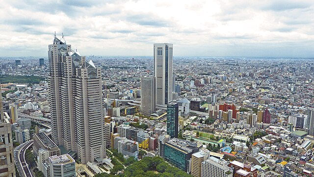 aerial view over the tokyo, japan skyline that shows many buildings and skyscrapers.