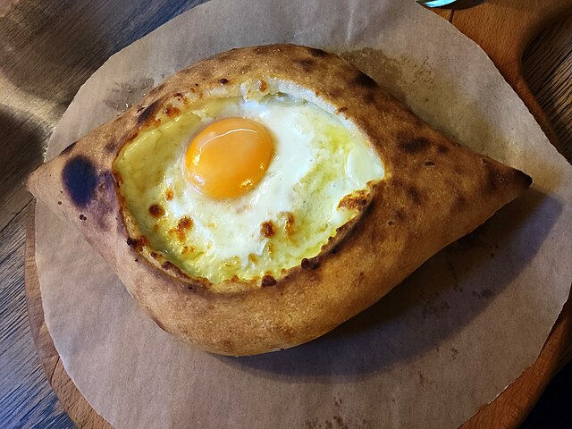 An image of a traditional dish in the country of Georgia called Khachapuri.