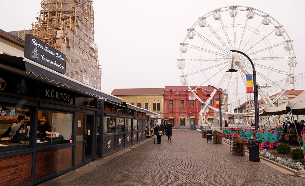 The large Ferris wheel dominates the backdrop of the market at Union Square