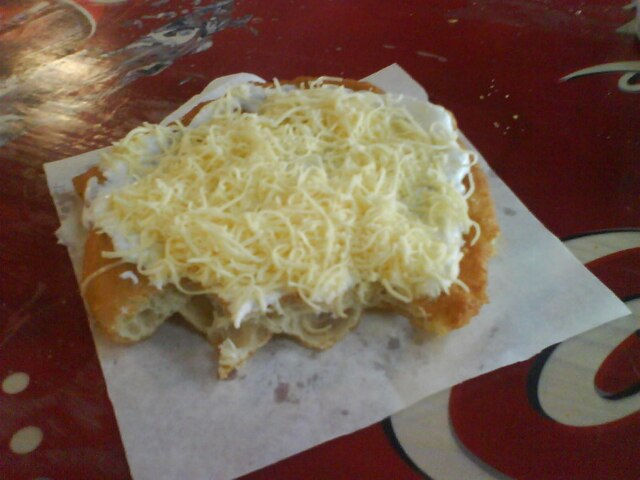 Traditional langos with sour cream and cheese