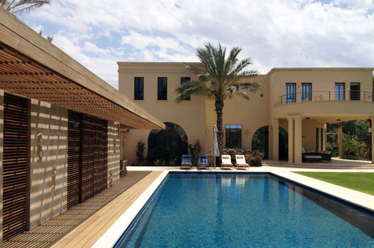 Pool and pavilion with existing house in background