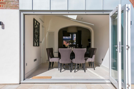 Fully openable façade to dining room in new addition