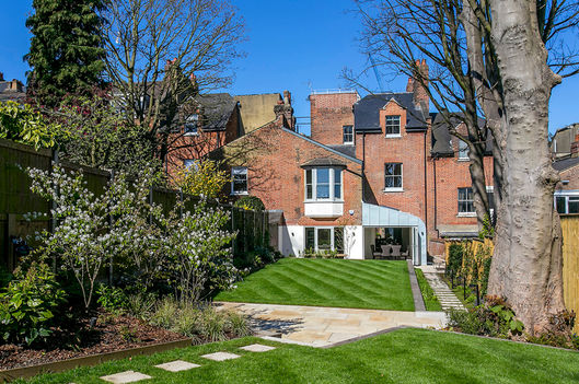 Terraced garden with path leading to rear of house