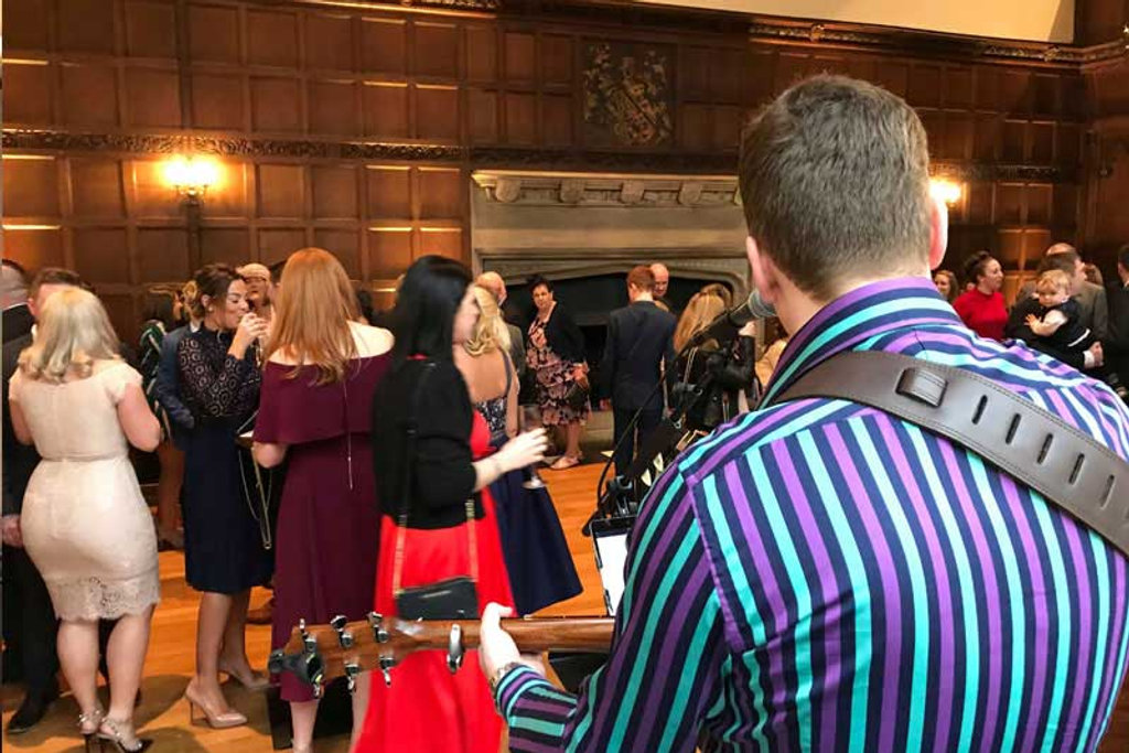 Tom Ryder playing at a wedding