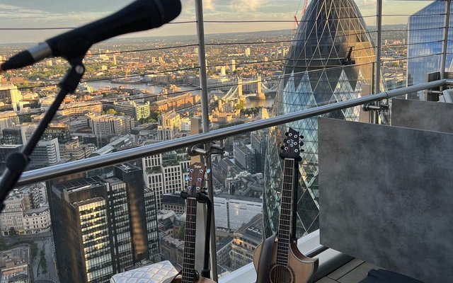 Tom Ryder playing at a wedding, from the post Corporate Event Singer London - My Performance at Heron Tower