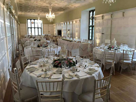 The banqueting hall at Hengrave Hall set for dinner at Kirsty and Adam's wedding