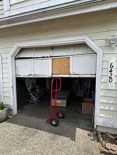 Owner of Trinitron Garage Doors installing a new garage door opener motor during a residential garage door repair service.