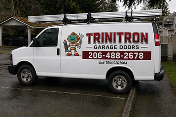 Trinitron Garage Doors service van with company decals parked at the shop, ready for garage door repair and installation jobs