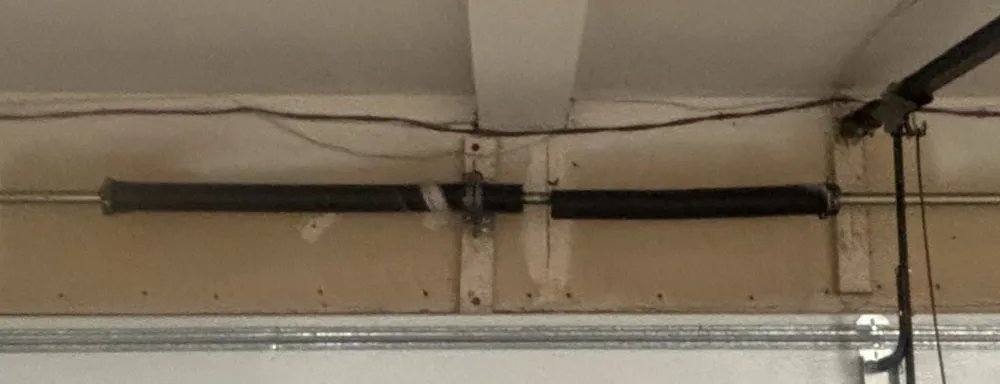 Close-up of the torsion spring assembly above Yong’s garage door in Seattle