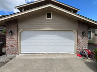 Owner of Trinitron Garage Doors installing a new garage door opener motor during a residential garage door repair service.