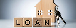 vecteezy_wooden-blocks-spelling-loan-sit-in-front-of-a-miniature_73605383.jpg