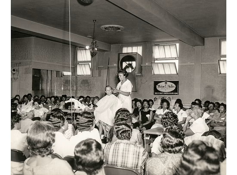 Madam C.J. Walker demonstrating products and training her sales agents.