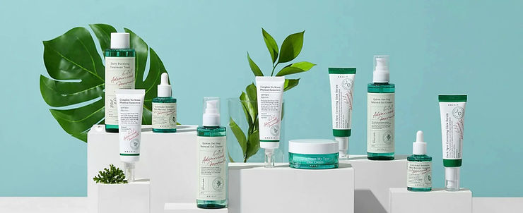 A vibrant display of Axis-Y skincare products, featuring toners, serums, and sunscreens, ⓒAxis-Y