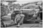 Black and white male portrait in unique style, man by car.