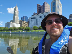 Robert Bazzle, Columbus Ohio portrait photographer, smiling in a natural-light portrait.