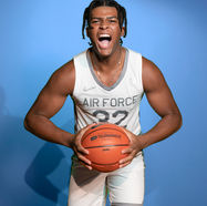 kolby yell headshot blue-X4.jpg