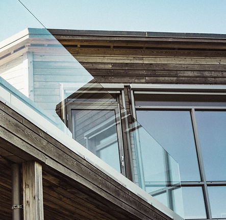 low-angle-shot-modern-wooden-house-with-glass-terrace-borders_edited.jpg