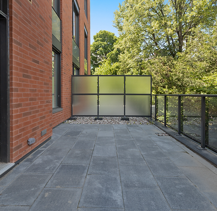 brown brick building near green trees du