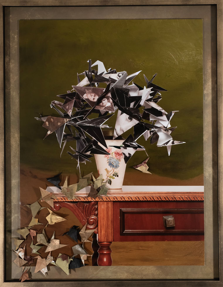 Mixed media photograph adding instability through origami birds made from family photos