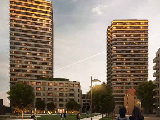 Außenansicht des modernen ‚upside‘-Wohnensembles in Berlin-Friedrichshain, hoch über der Spree, mit klarer Architektur und beeindruckender Höhe.