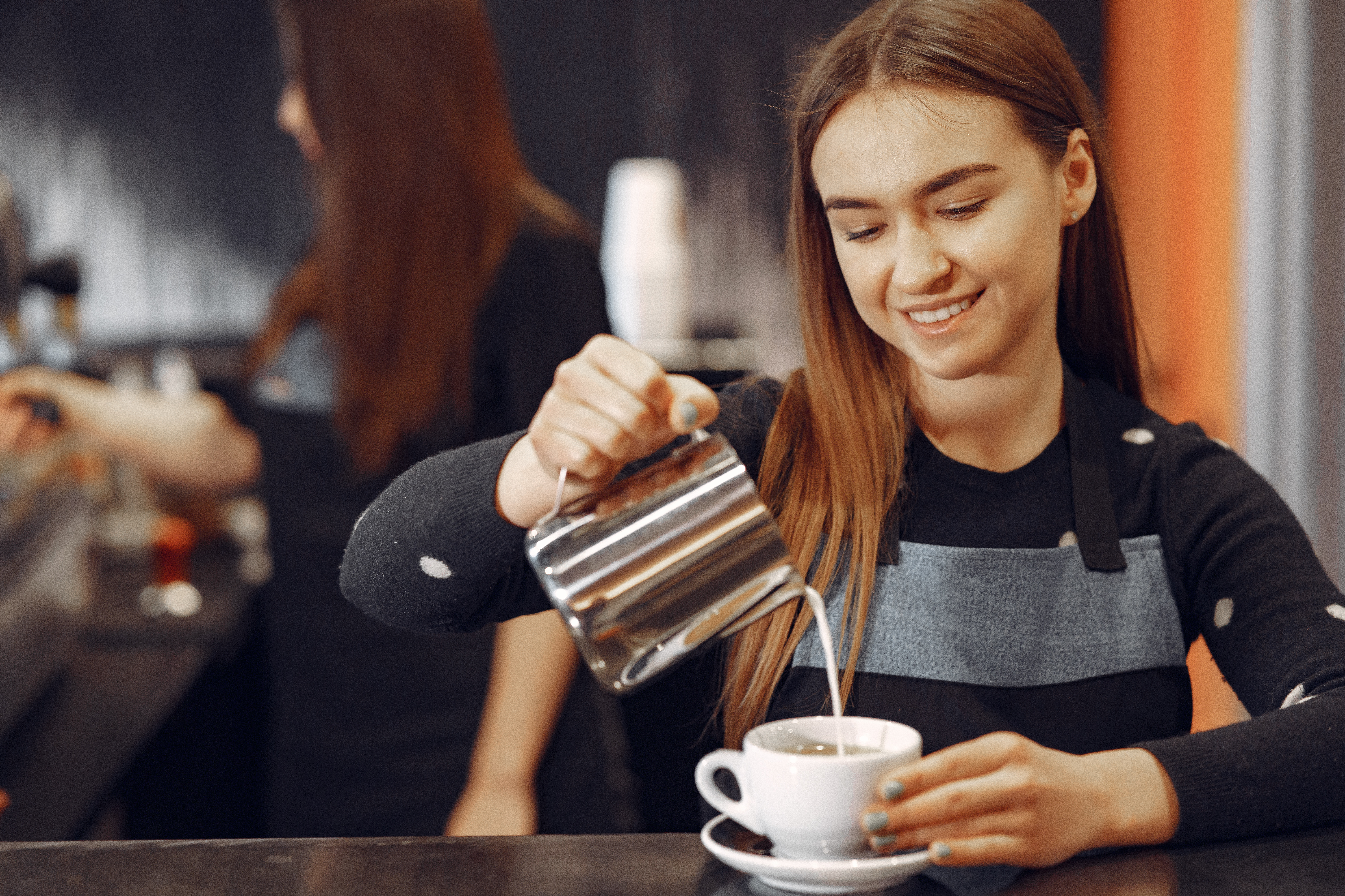 young-barista-girl-makes-coffee-smiles.jpg