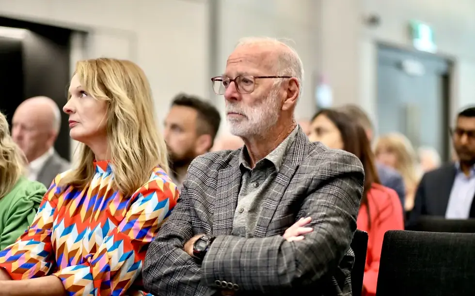 Auckland mayor Wayne Brown listens to the Minister's announcement. Photo: RNZ / Marika Khabazi