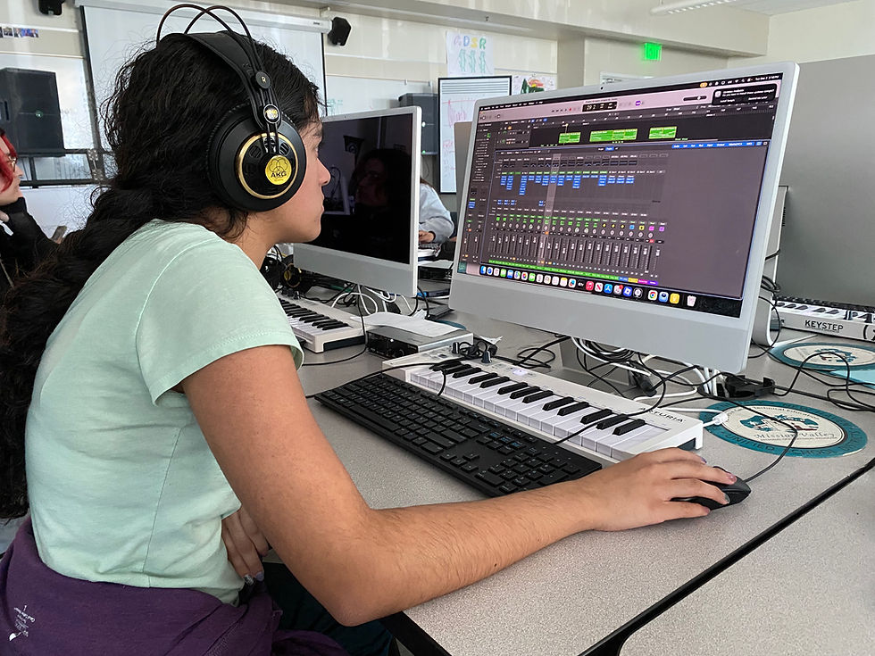 Photo by Monica Real | An MVROP student works hard to mix up a song.