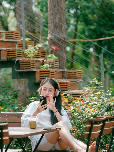 A woman scrolling on her phone, making an appointment at a hair salon