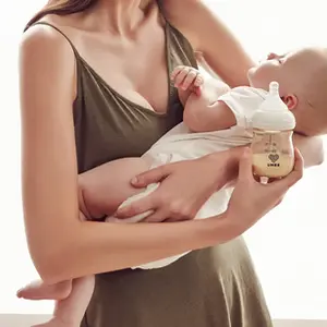 Mom holding baby and bottle