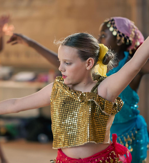 DanceEd students performing with sequin boleros