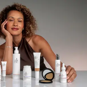 Woman with Glo Skin Beauty mineral makeup products for healthy-looking skin.
