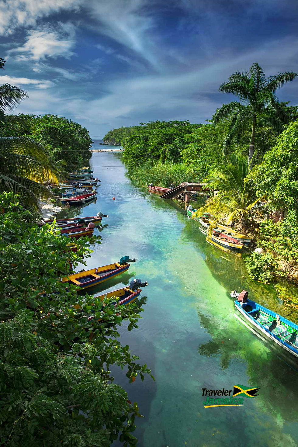 Colorful fishing canoes line the serene banks of the White River, surrounded by lush greenery and a clear, tranquil flow under a vibrant sky.