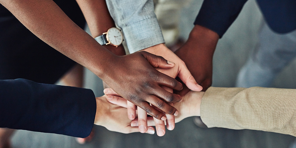 Diverse hands put together to represent team building.