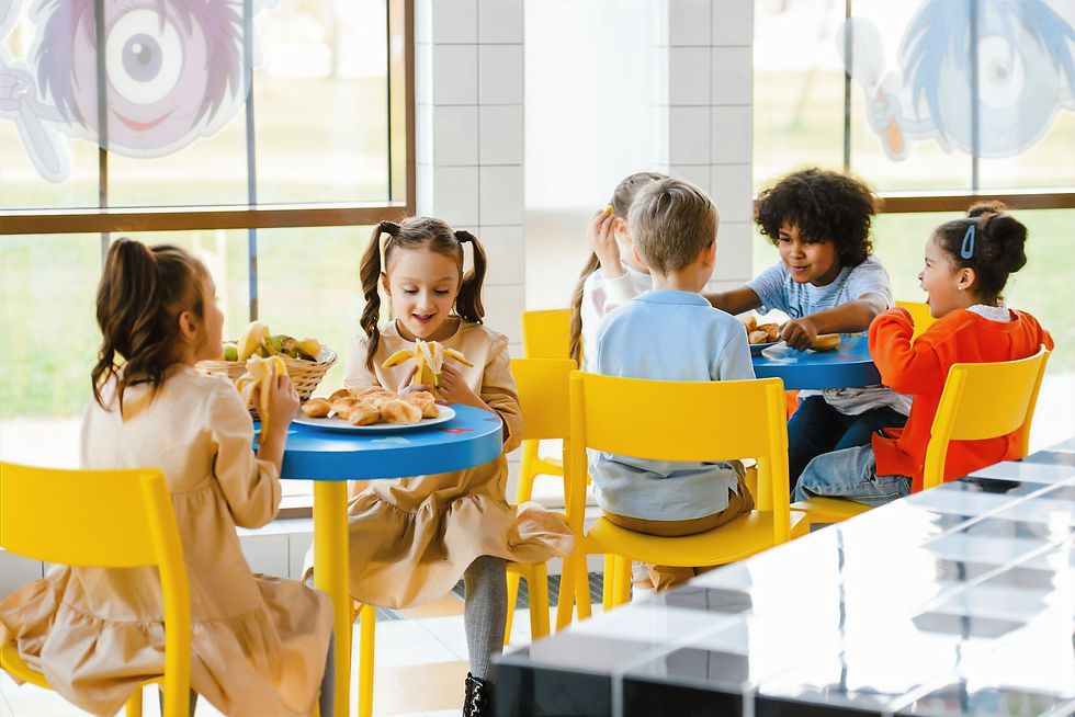 Children are enjoying a fun meal together at a colorful indoor play area.