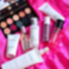 collage of skincare without labels in shades of pink in the background.jpg