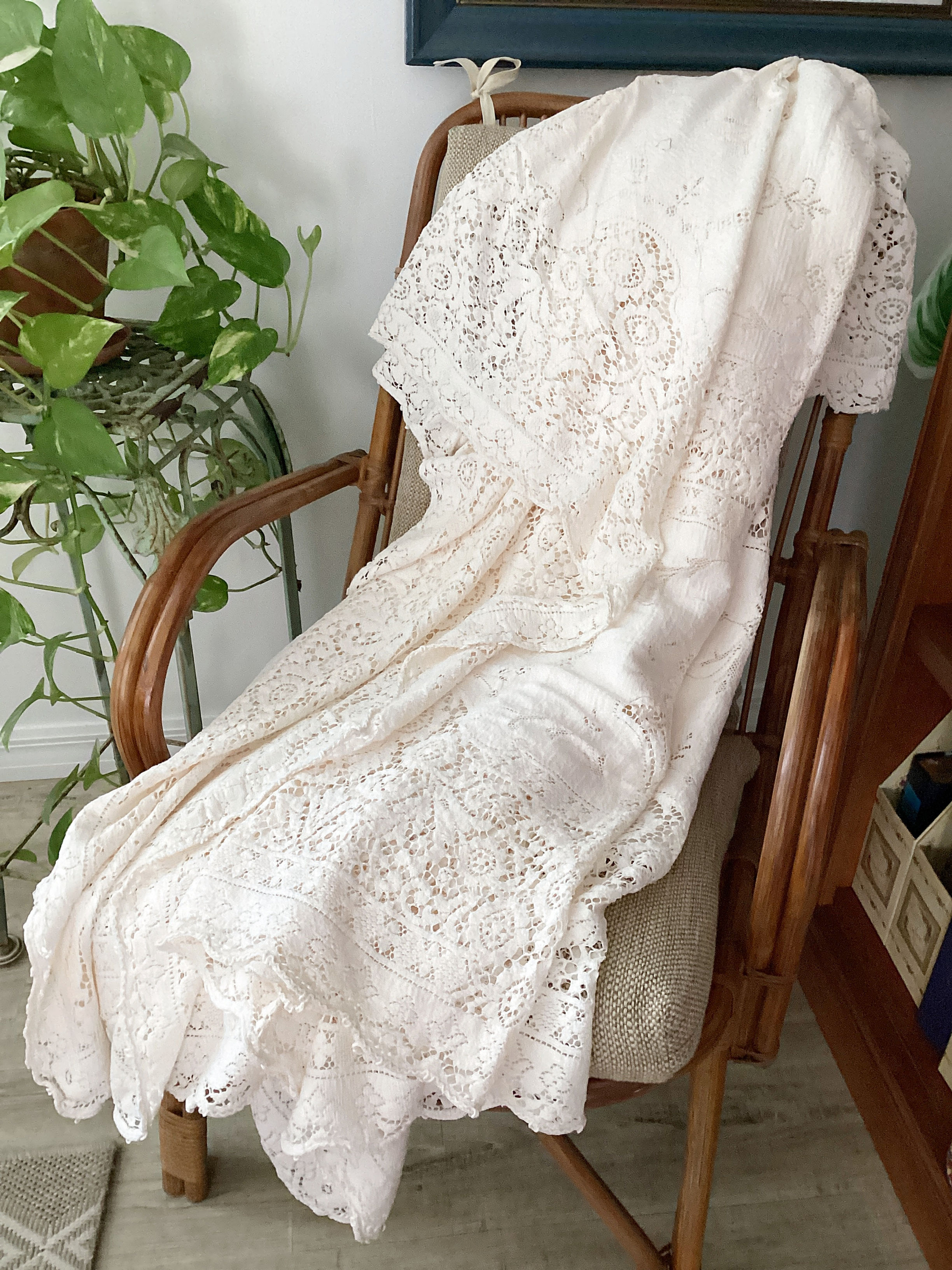 round quaker lace tablecloth displayed on a chair