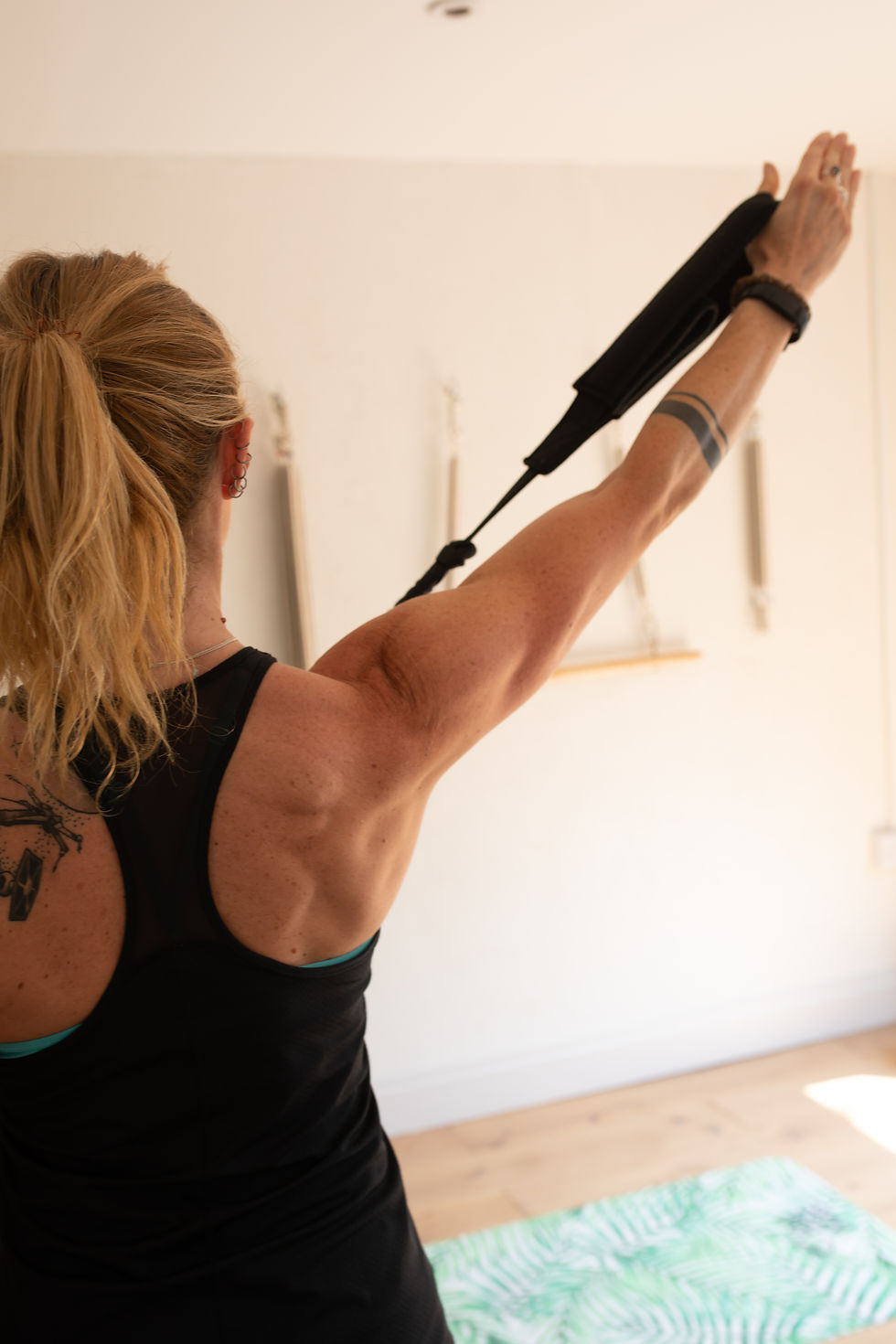 Client exercising on pilates reformer