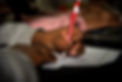 Boy writing with pen