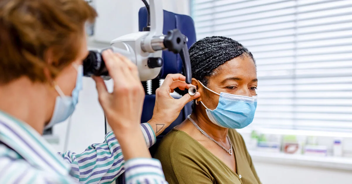 Doctor-examining-the-ear-of-a-senior-woman-in-clinic-1200x628-facebook-1200x628.jpg.webp