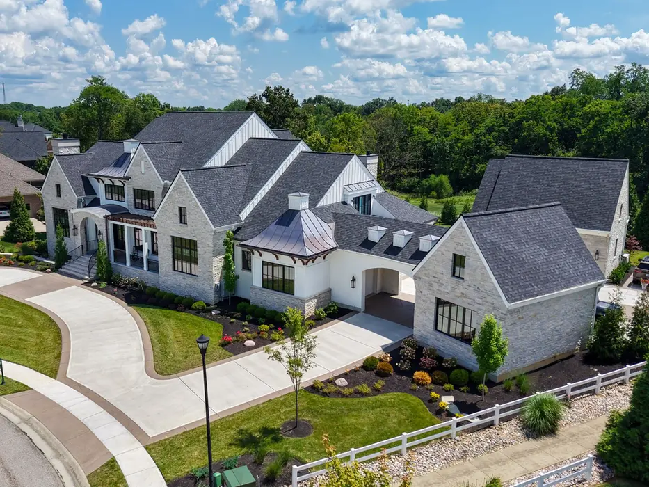 Luxury custom limestone estate with courtyard driveway in the Triple Crown community of Kentucky built by Frazier Homes.
