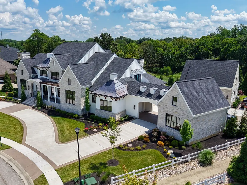 Aerial view of a luxury custom home by Frazier Homes showcasing refined architecture, stone exterior, and thoughtfully designed landscaping.