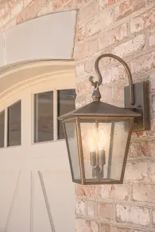 Close-up of custom exterior lighting on a luxury home in Lebanon, Ohio built by Frazier Homes, showcasing architectural craftsmanship and elegant design details.